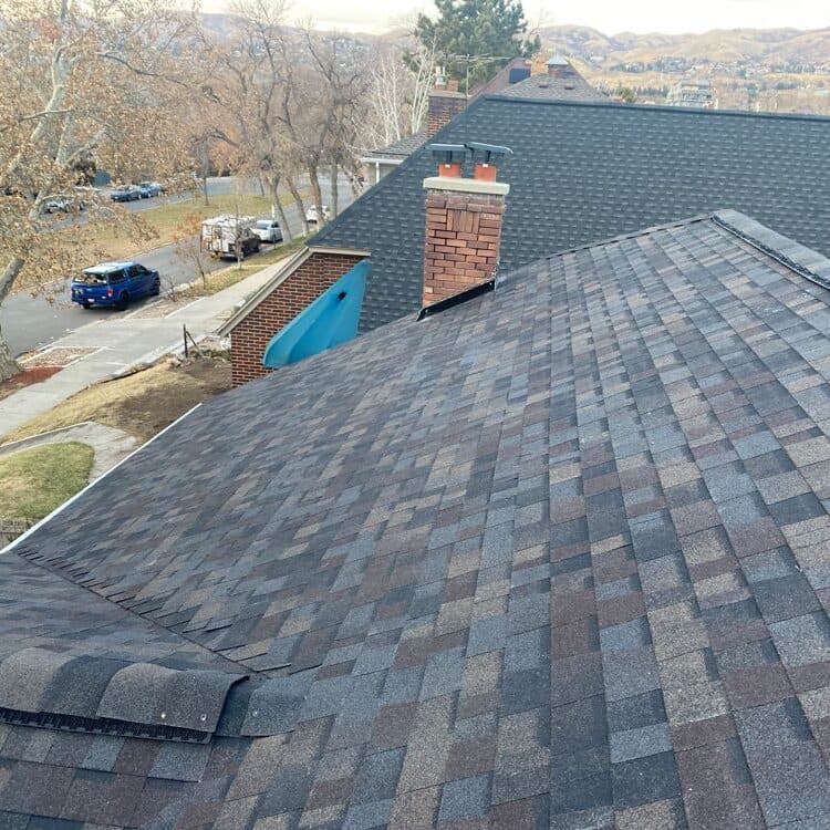 New roof installation with brick chimney