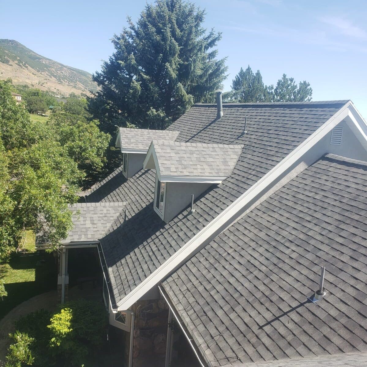 Roof with dormers against mountain scenery