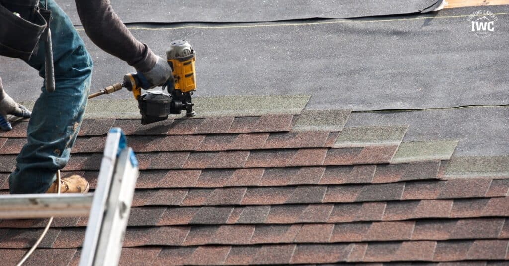 Utah roofing contractor inspecting a home roof before replacement