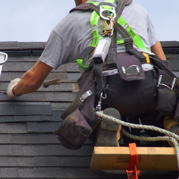Roofing team installing high-quality shingles on residential home