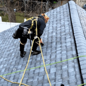 Roofer and homeowner shaking hands after estimate