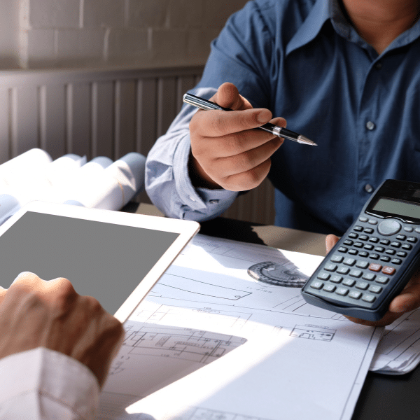 Homeowner discussing roofing estimate with contractor