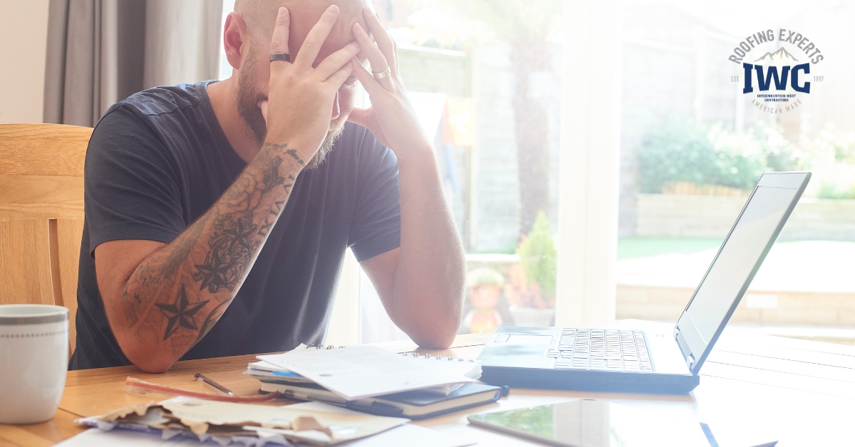 Homeowner reviewing financing paperwork for a roof replacement